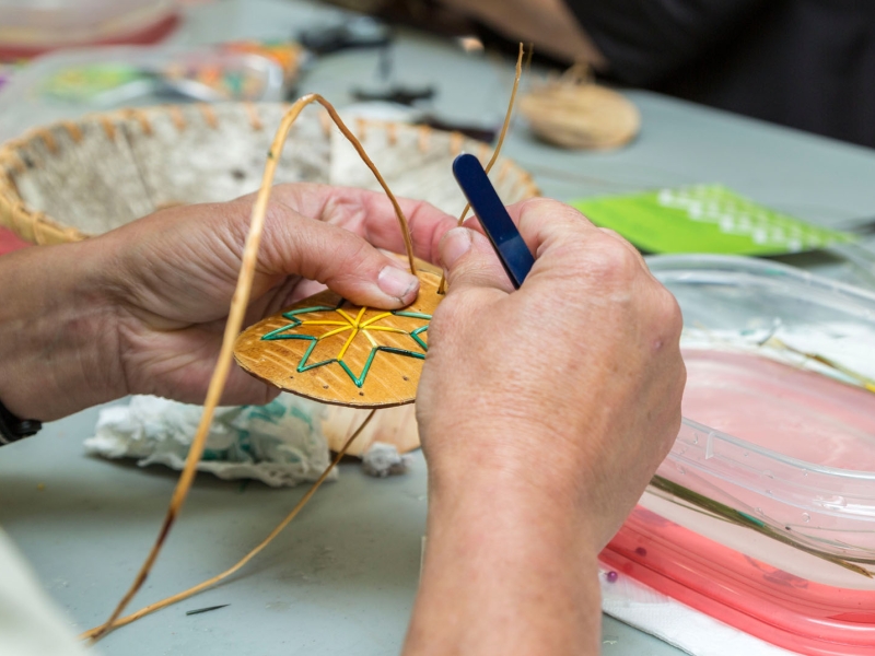 Close-up of hands doing quill work, Lennox Island, PEI